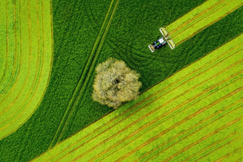 Aerial Sunset Photography of A Tractor In A Field